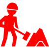 worker-of-construction-working-with-a-shovel-beside-material-pile